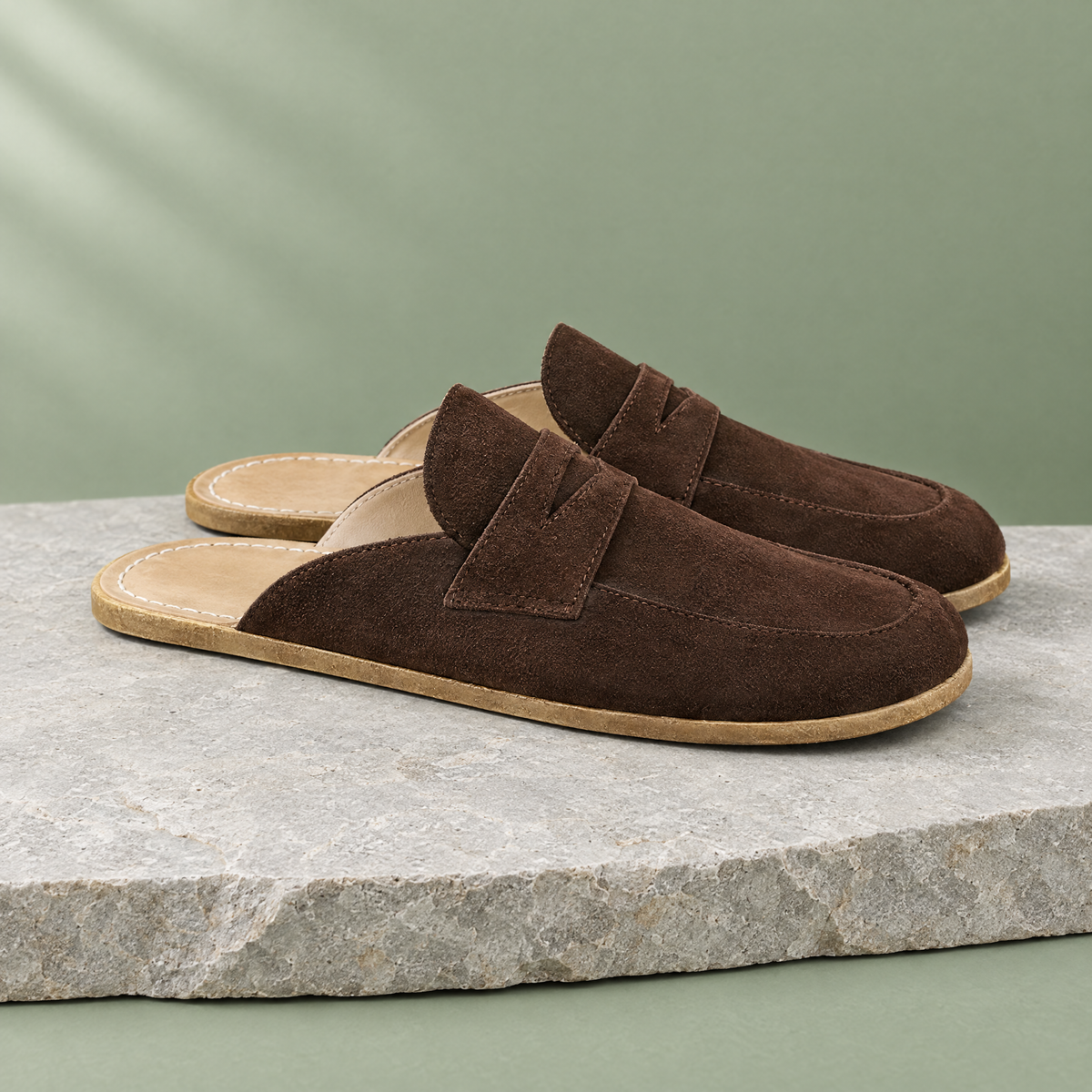 Flint grounding backless penny clog in Umber Suede, three-quarter view