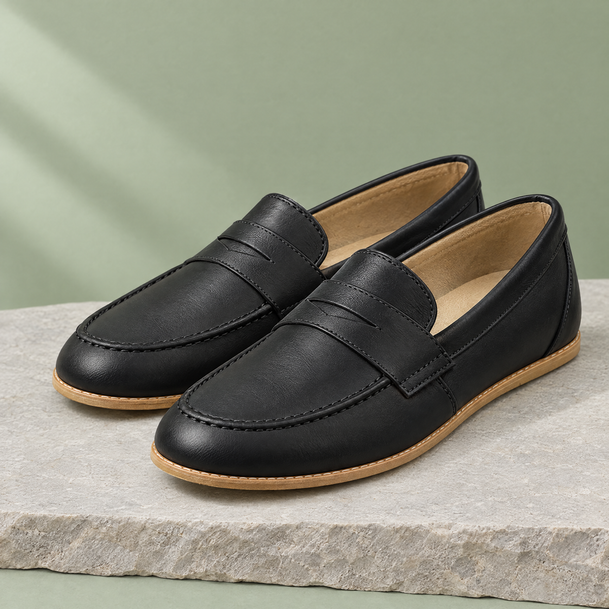 Laurel grounding penny loafer in Charcoal Black