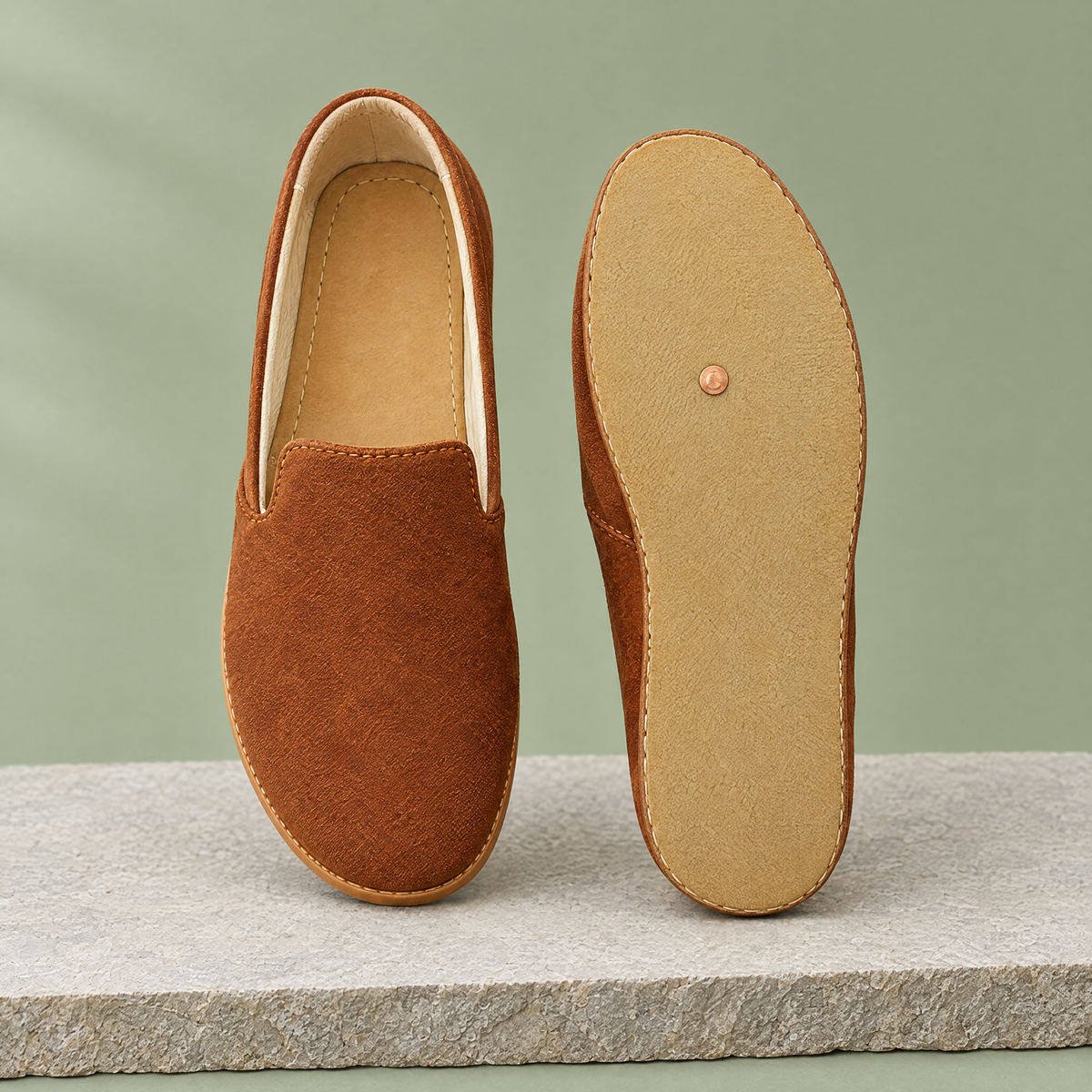 Leather outsole with copper grounding rivet under the ball of the foot