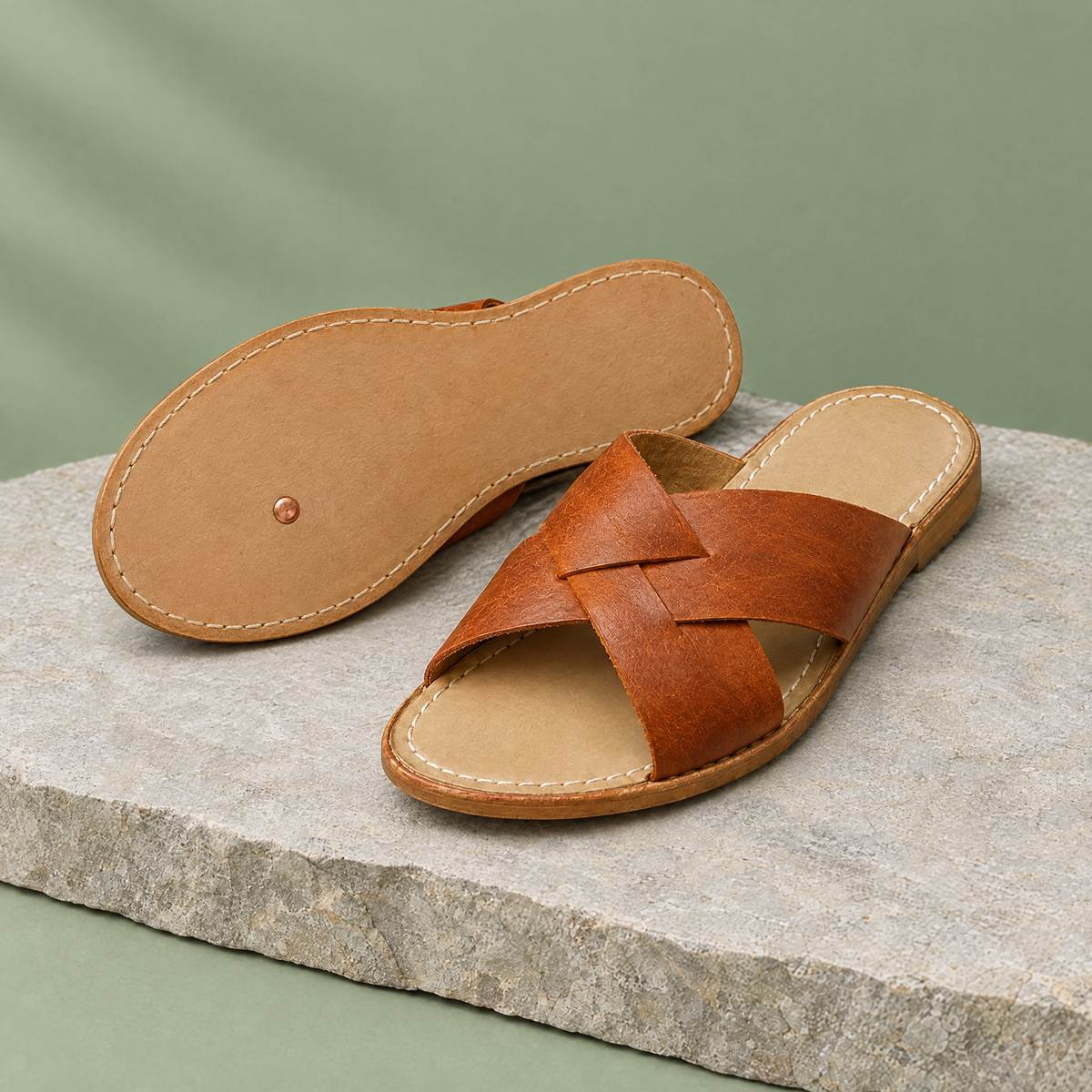 Leather outsole with copper grounding rivet under the ball of the foot
