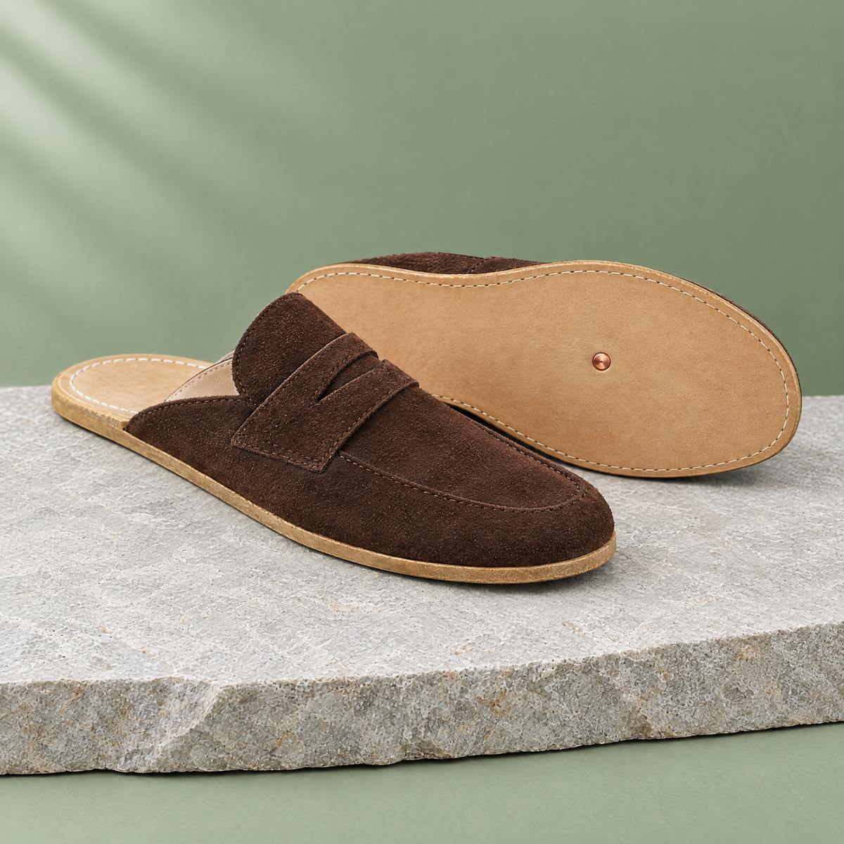 Leather outsole with copper grounding rivet under the ball of the foot