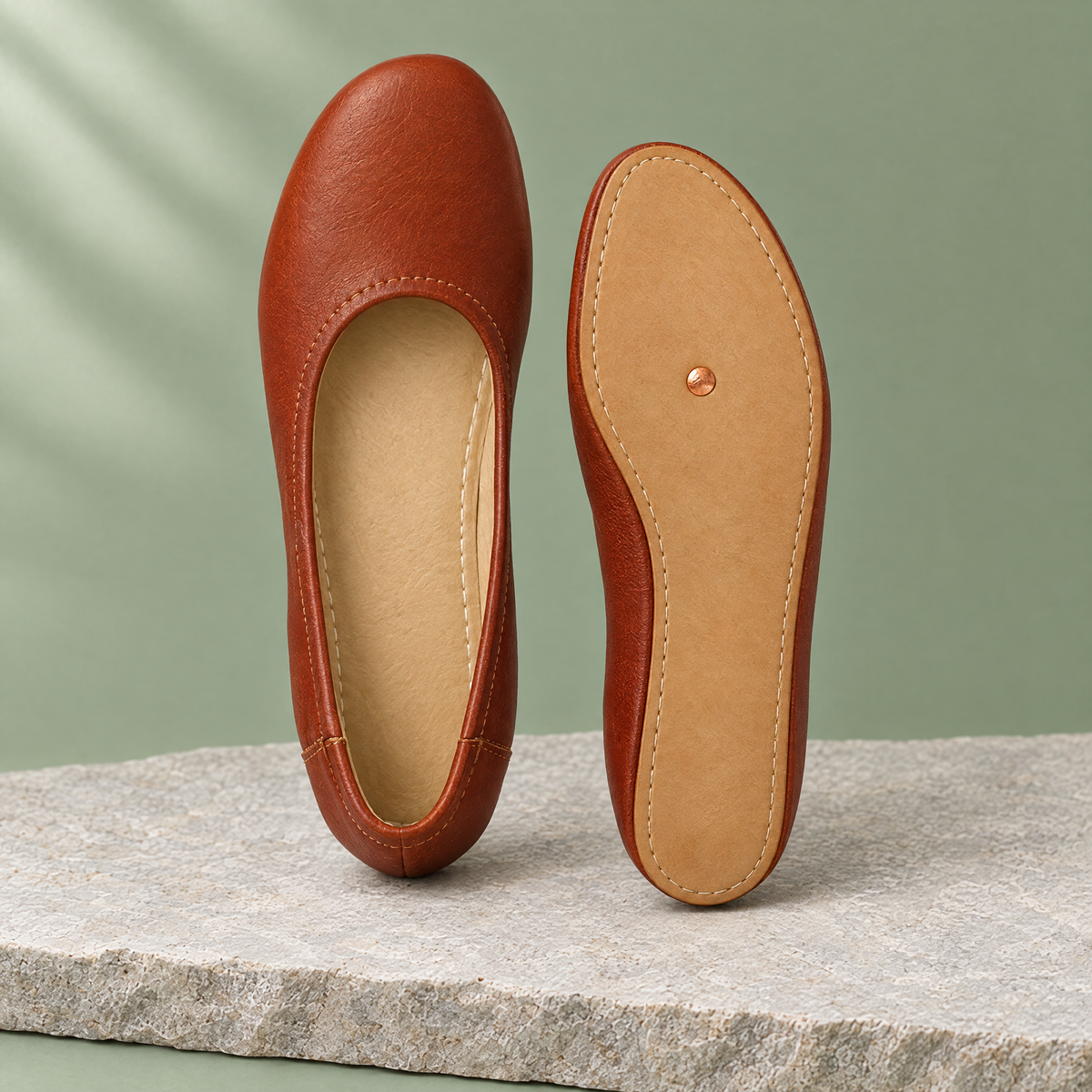Leather outsole with copper grounding rivet under the ball of the foot