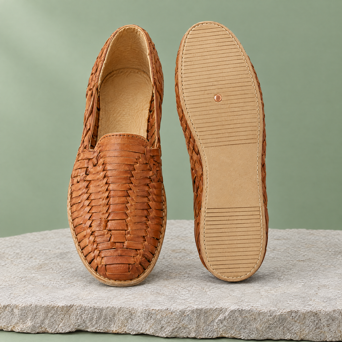 Leather outsole with copper grounding rivet under the ball of the foot