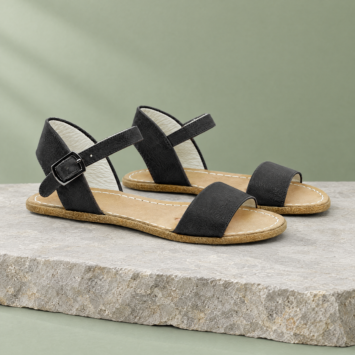 Tide grounding ankle-strap sandal in Stone Black