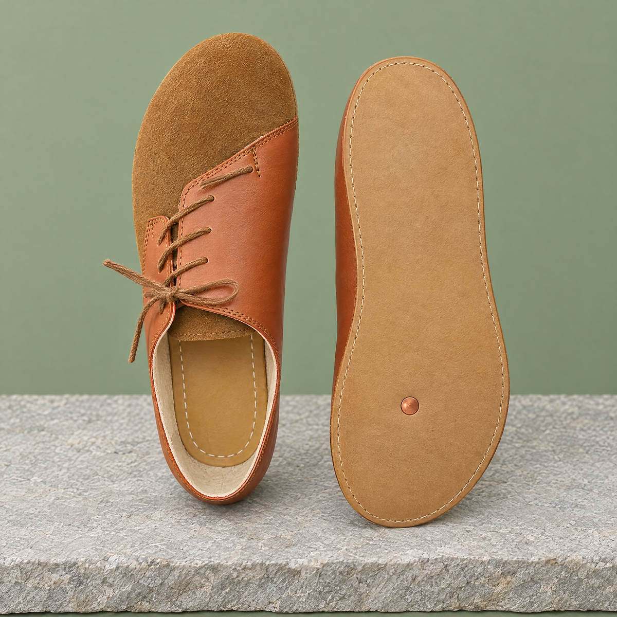 Leather outsole with copper grounding rivet under the ball of the foot
