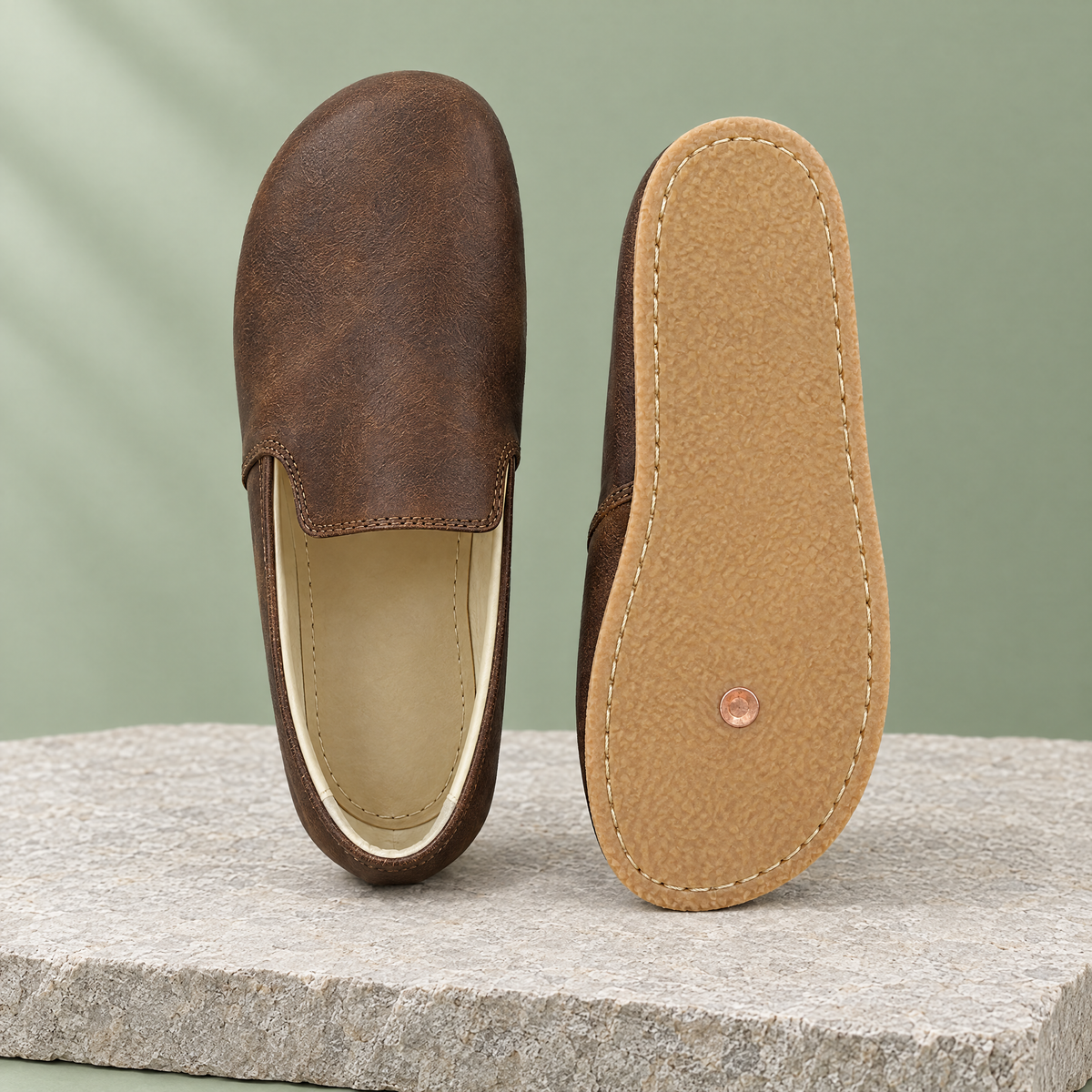 Leather outsole with copper grounding rivet under the ball of the foot