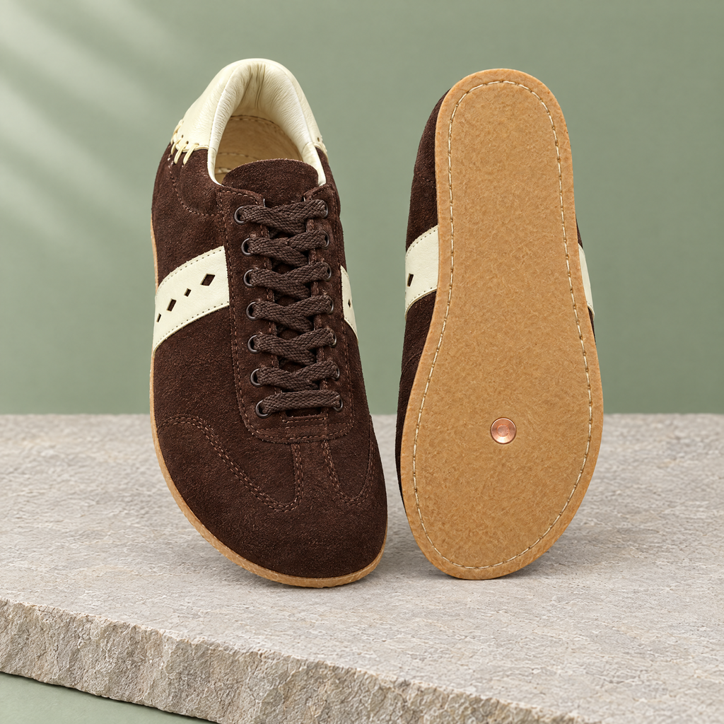 Leather outsole with copper grounding rivet under the ball of the foot