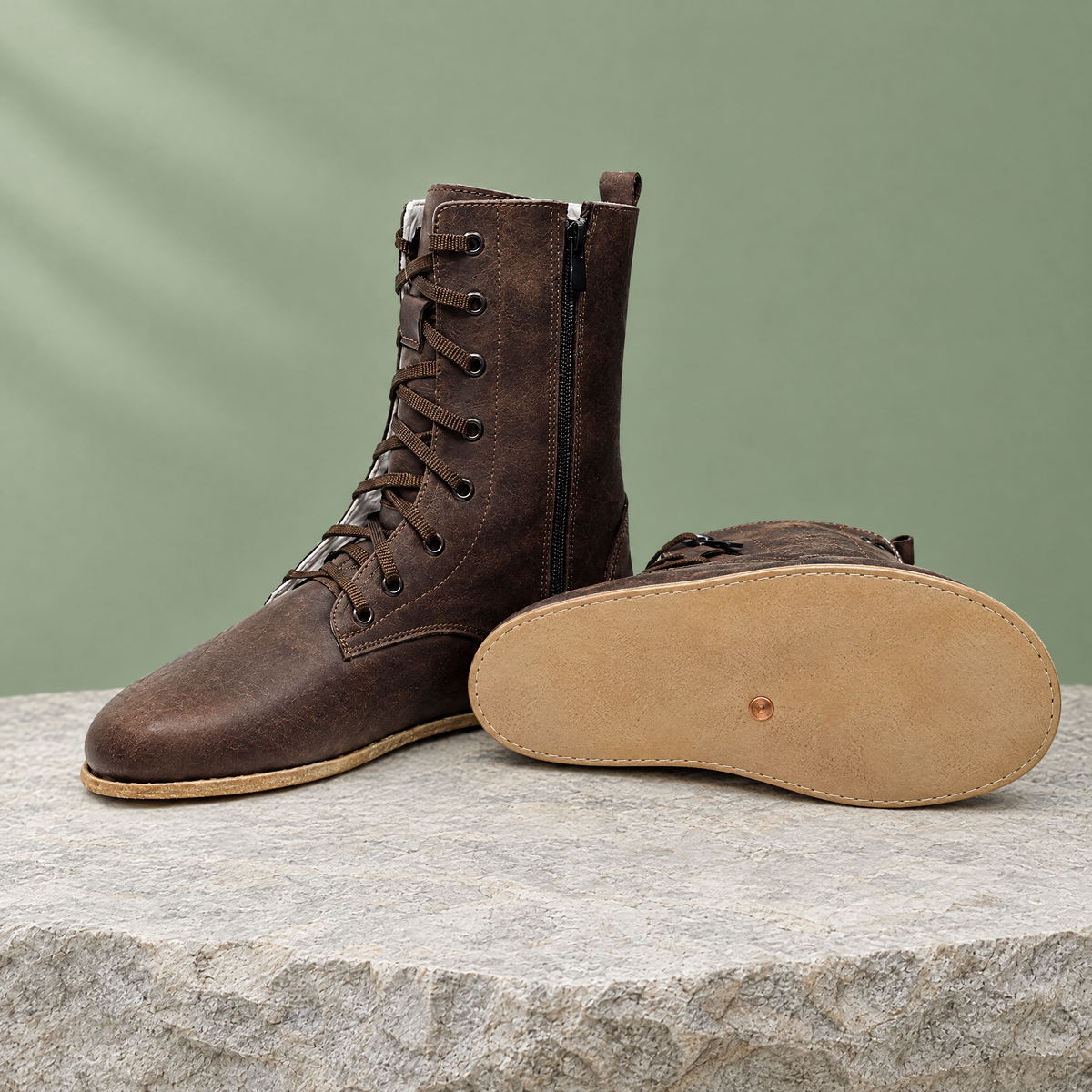 Leather outsole with copper grounding rivet under the ball of the foot