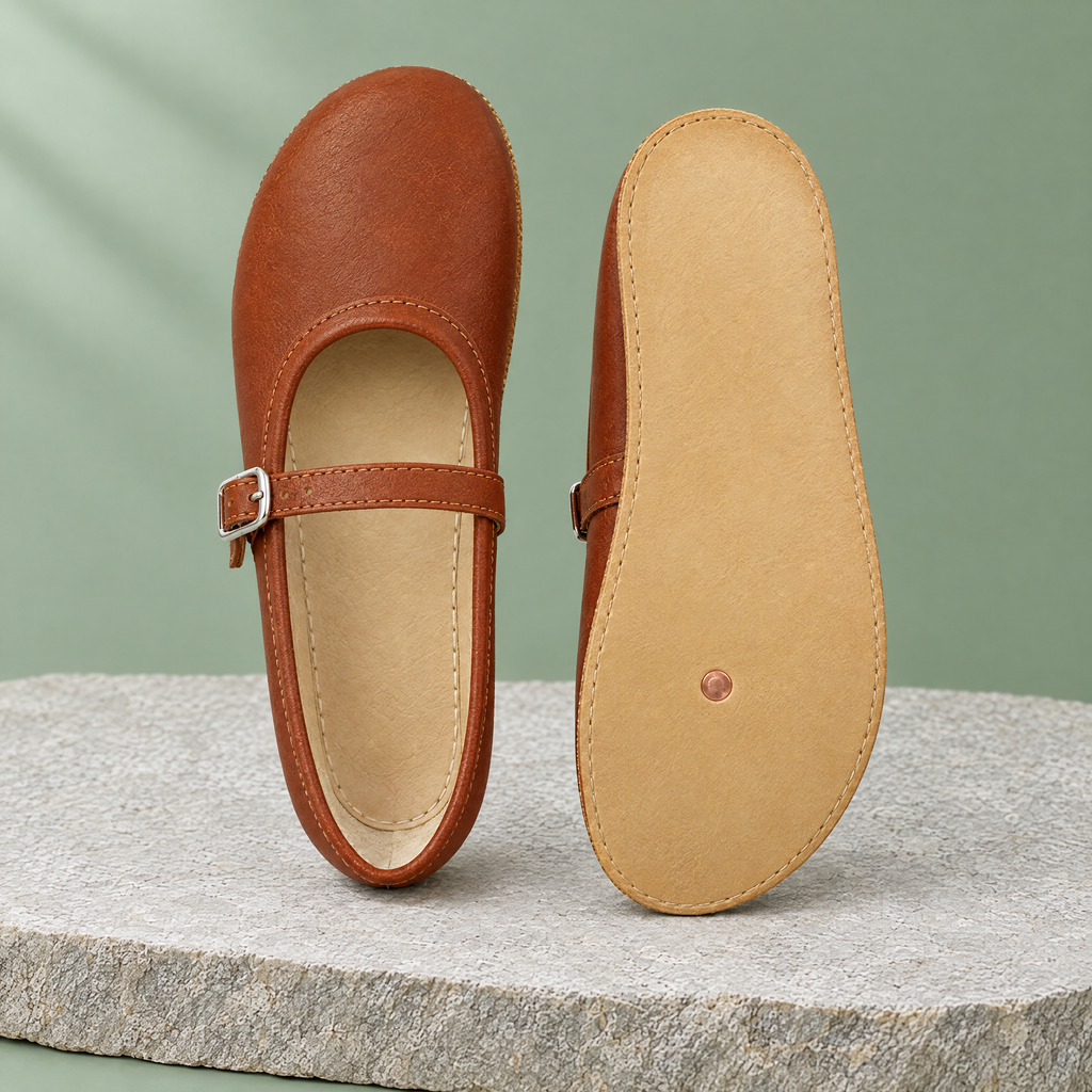Leather outsole with copper grounding rivet under the ball of the foot