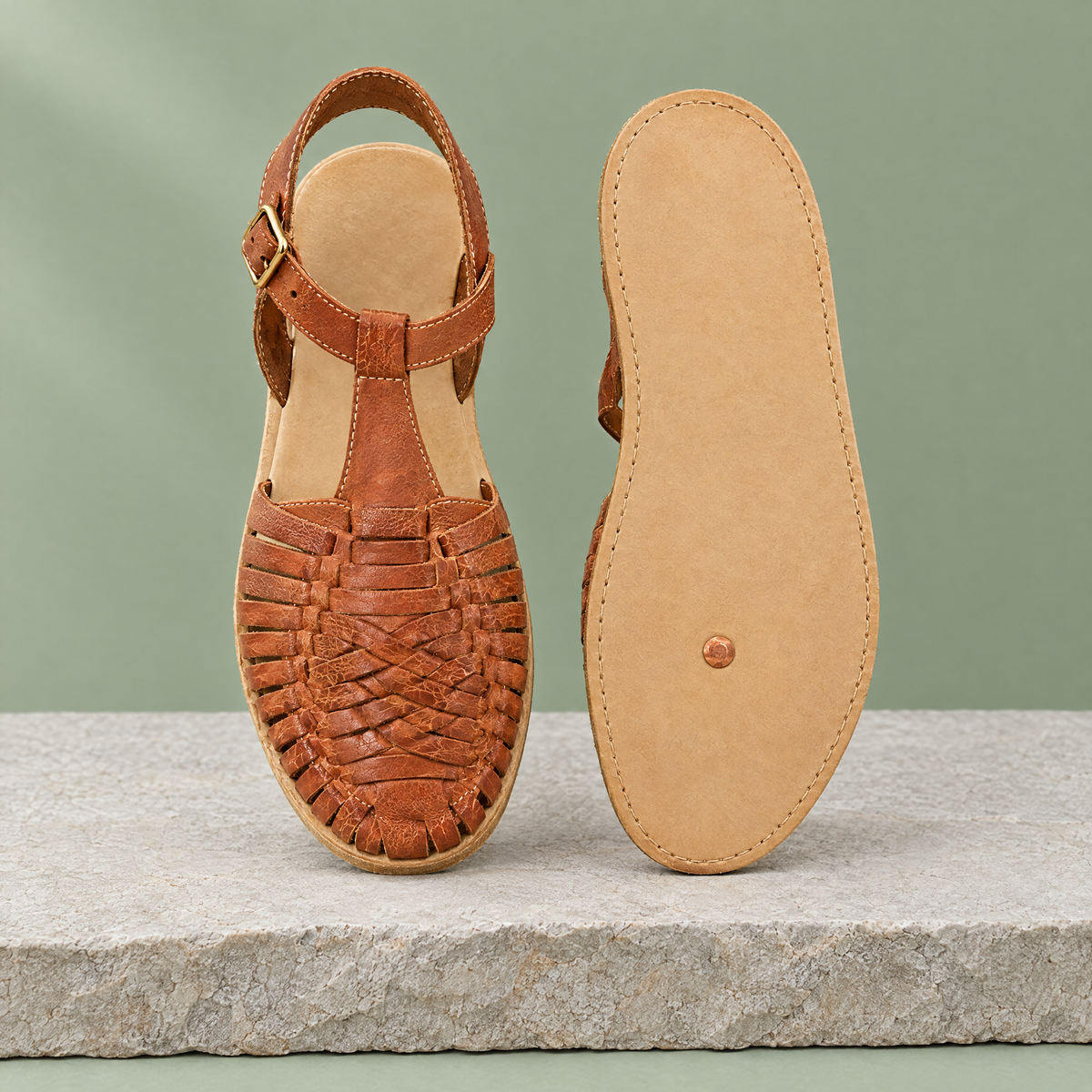 Leather outsole with copper grounding rivet under the ball of the foot