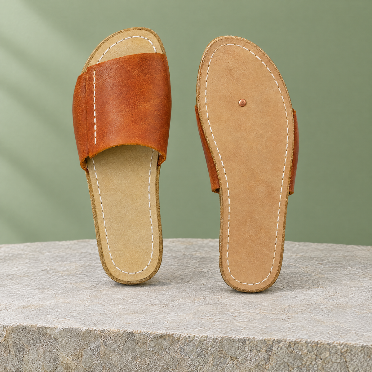 Leather outsole with copper grounding rivet under the ball of the foot