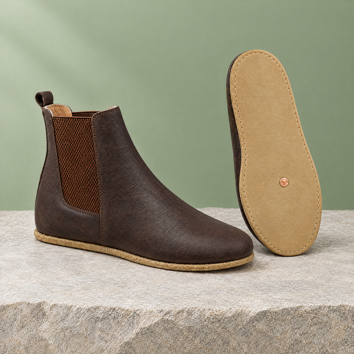 Leather outsole with copper grounding rivet under the ball of the foot