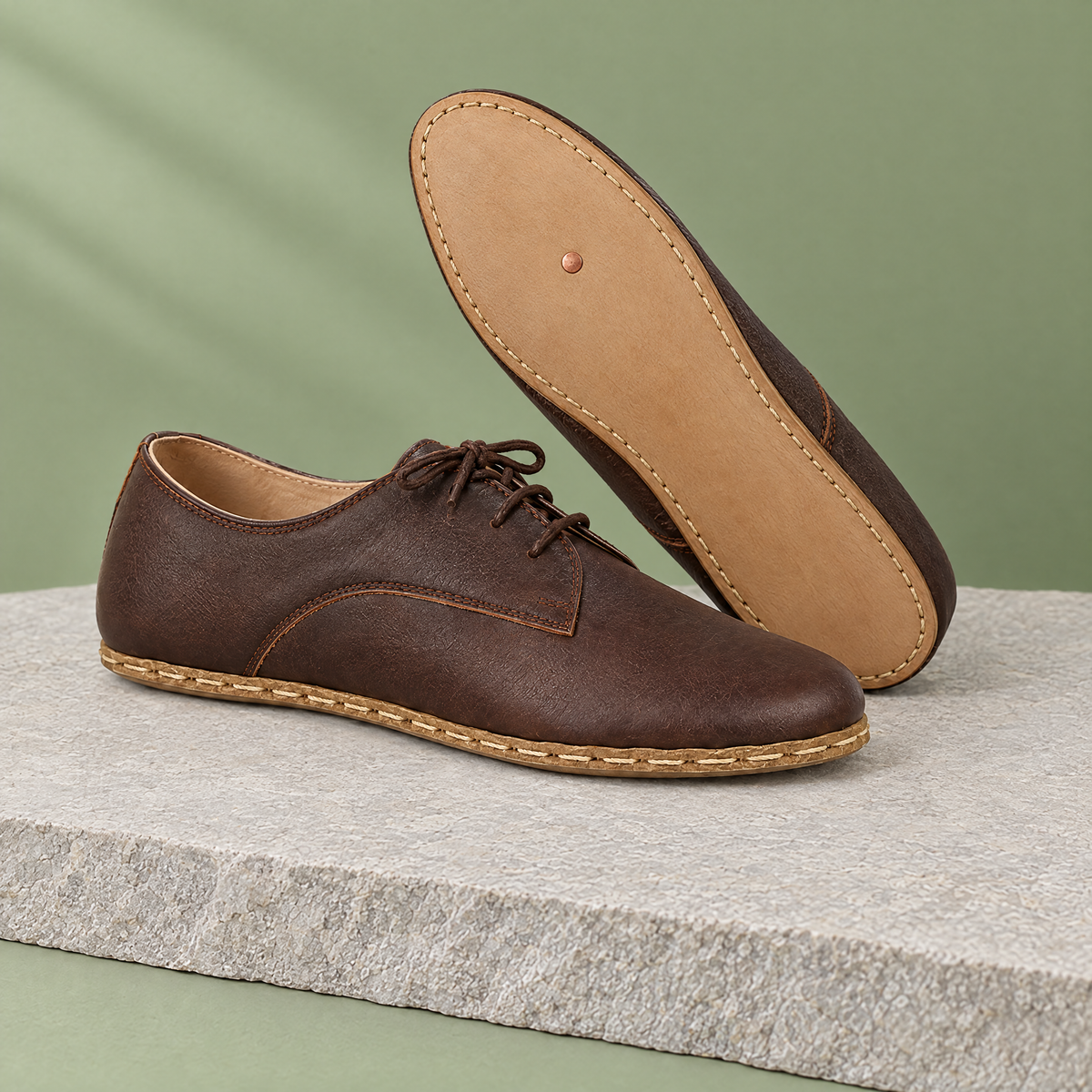 Leather outsole with copper grounding rivet under the ball of the foot