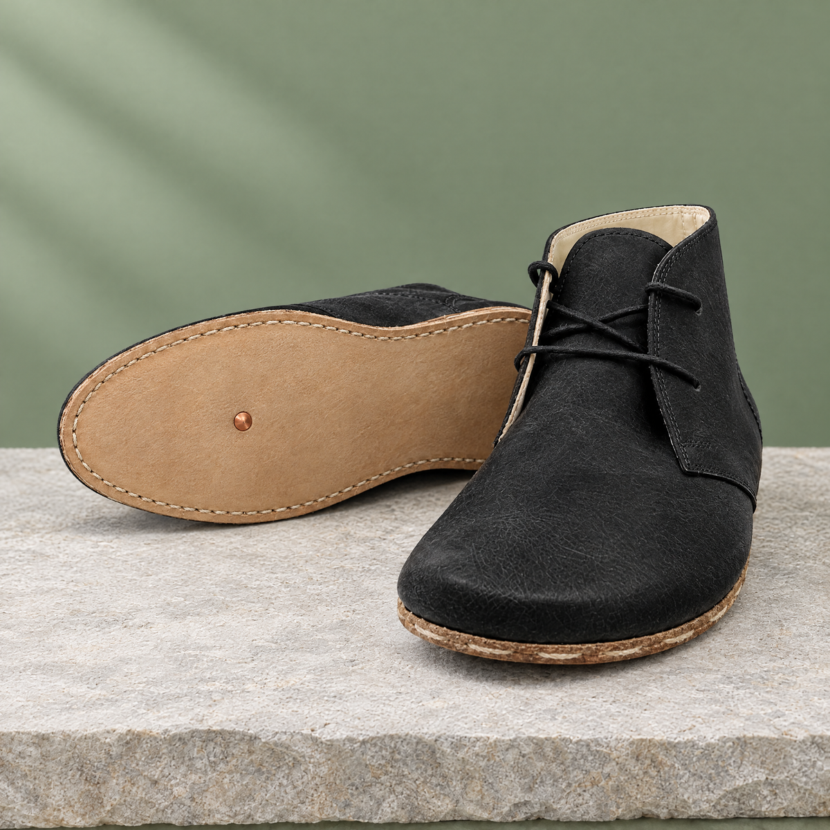 Leather outsole with copper grounding rivet under the ball of the foot