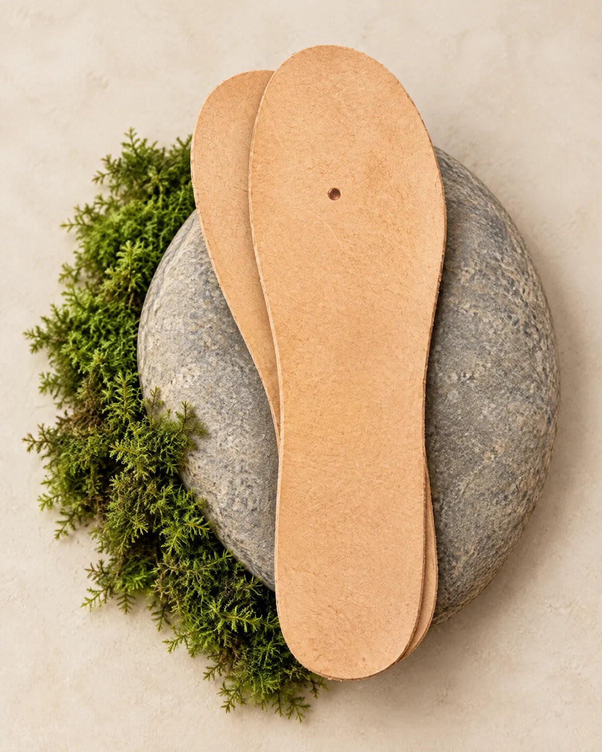Leather insole with copper grounding rivet